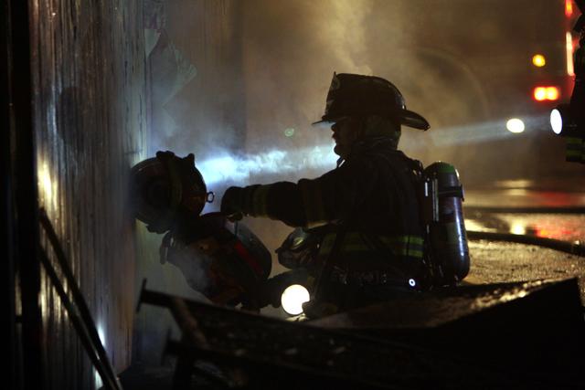 Mutual aid Katonah Old Deer Park Fire. Lt Kane opens up the side of the building for hose line access.